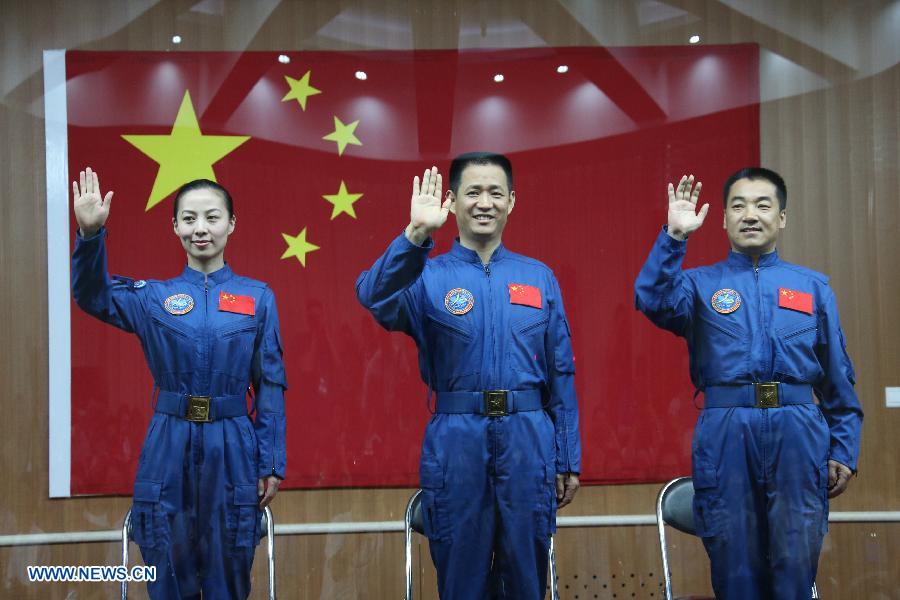 he three astronauts of the Shenzhou-10 manned spacecraft mission, Nie Haisheng (C), Zhang Xiaoguang (R) and Wang Yaping, meet the media at the Jiuquan Satellite Launch Center in Jiuquan, northwest China's Gansu Province, June 10, 2013. The Shenzhou-10 manned spacecraft will be launched at the Jiuquan Satellite Launch Center at 5:38 p.m. Beijing Time (0938 GMT) June 11. (Xinhua/Wang Jianmin) 