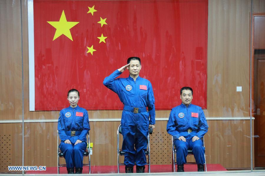 The three astronauts of the Shenzhou-10 manned spacecraft mission, Nie Haisheng (C), Zhang Xiaoguang (R) and Wang Yaping, meet the media at the Jiuquan Satellite Launch Center in Jiuquan, northwest China's Gansu Province, June 10, 2013. The Shenzhou-10 manned spacecraft will be launched at the Jiuquan Satellite Launch Center at 5:38 p.m. Beijing Time (0938 GMT) June 11. (Xinhua/Li Gang)