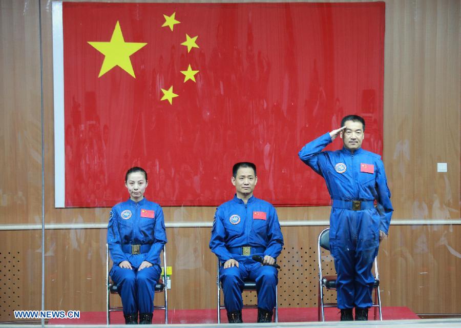 The three astronauts of the Shenzhou-10 manned spacecraft mission, Nie Haisheng (C), Zhang Xiaoguang (R) and Wang Yaping, meet the media at the Jiuquan Satellite Launch Center in Jiuquan, northwest China's Gansu Province, June 10, 2013. The Shenzhou-10 manned spacecraft will be launched at the Jiuquan Satellite Launch Center at 5:38 p.m. Beijing Time (0938 GMT) June 11. (Xinhua/Li Gang)