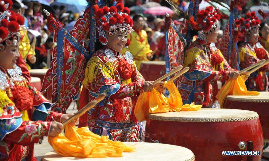 Actors beat drums at a cultural festival during the Dragon Boat (Duanwu) Festival holiday in Yanqing County of Beijing, capital of China, June 10, 2013. The Duanwu Festival, which is celebrated across China to pay homage to Qu Yuan, a patriotic poet during the Warring State Period (475-221 BC), falls on the fifth day of the fifth month in the Chinese lunar calendar, or June 12 this year. (Xinhua/Li Xin) 