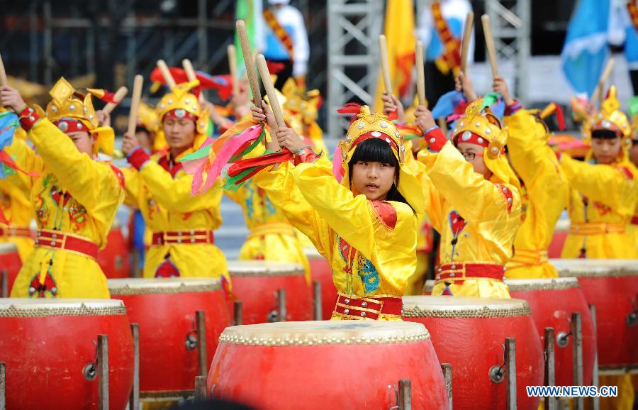 Drummers perform during the traditional "Holy Water Festival" in Wudalianchi, northeast China's Heilongjiang Province, June 11, 2013. The festival was listed as the National Intangible Cultural Heritage in 2010. (Xinhua/Wang Jianwei)