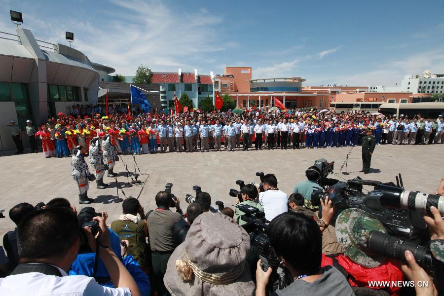 Astronauts Nie Haisheng, Zhang Xiaoguang and Wang Yaping attend the setting-out ceremony of the manned Shenzhou-10 mission at the Jiuquan Satellite Launch Center in Jiuquan, northwest China's Gansu Province, June 11, 2013. (Xinhua/Li Gang)