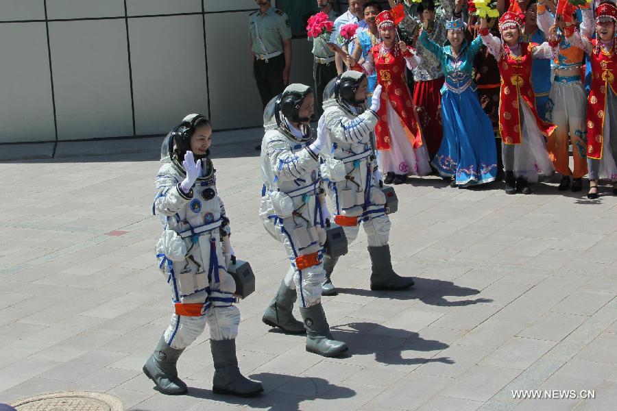 Astronauts Nie Haisheng (C), Zhang Xiaoguang (R) and Wang Yaping attend the setting-out ceremony of the manned Shenzhou-10 mission at the Jiuquan Satellite Launch Center in Jiuquan, northwest China's Gansu Province, June 11, 2013. (Xinhua/Li Gang)
