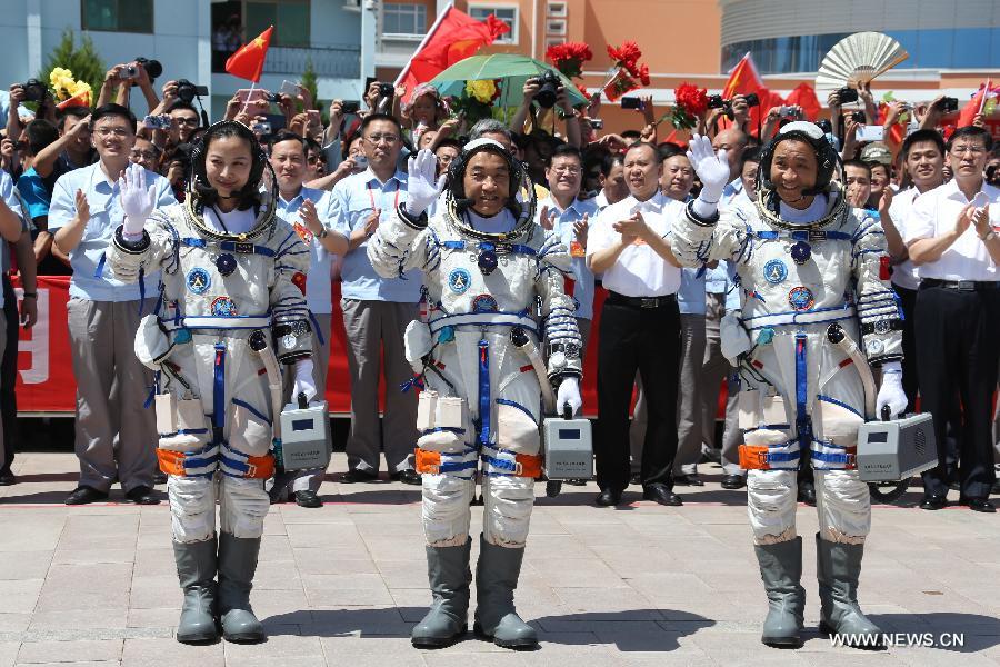 Astronauts Nie Haisheng (R), Zhang Xiaoguang (C) and Wang Yaping attend the setting-out ceremony of the manned Shenzhou-10 mission at the Jiuquan Satellite Launch Center in Jiuquan, northwest China's Gansu Province, June 11, 2013. (Xinhua/Wang Jianmin)