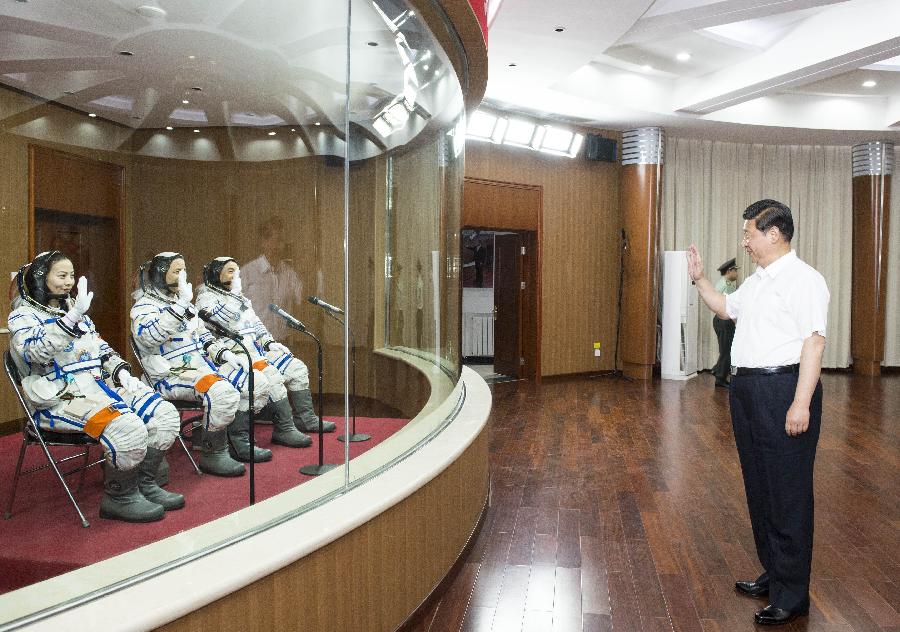 Chinese President Xi Jinping (R) attends a see-off ceremony for Chinese astronauts of a manned space mission at the astronauts' apartment building at the Jiuquan Satellite Launch Center in Jiuquan, northwest China's Gansu Province, June 11, 2013. The three astronauts are Nie Haisheng, Zhang Xiaoguang and Wang Yaping. (Xinhua/Li Xueren)