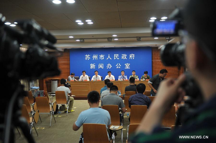 A press conference is held by the local government after an explosion toppled a three-story building in Suzhou City, east China's Jiangsu Province, June 11, 2013. Twenty people who were buried following an explosion of the staff canteen had been found. Eleven of them died in hospital, while the remaining nine are still receiving treatment in two local hospitals, according to the press briefing. A preliminary investigation showed that the blast was caused by a gas leak. (Xinhua/Shen Peng)