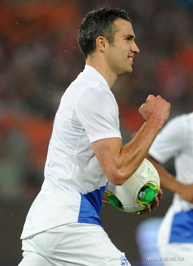 Robin van Persie of the Netherlands celebrates scoring a goal by penalty kick during the international friendly soccer match against China at the Workers Stadium in Beijing, capital of China, June 11, 2013. (Xinhua/Gong Lei) 