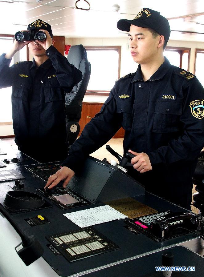 Crew members check the facilities on the ship "Haixun 01" of China's Maritime Safety Administration (MSA) before leaving Shanghai, east China, June 10, 2013. The public service ship will conduct a 62-day voyage to visit Australia, Indonesia, Myanmar and Malaysia. (Xinhua/Chen Fei)