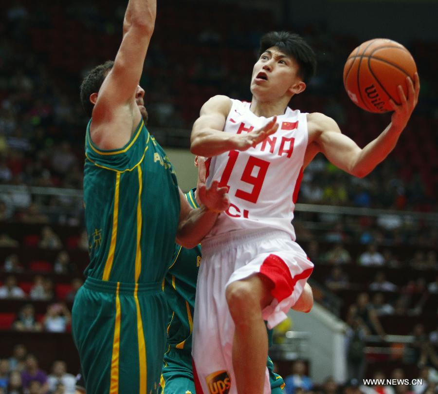 China's Liu Xiaoyu (R) goes to the basket during the 2013 Sino-Australian Men's International Basketball Challenge in Tianjin, north China, June 12, 2013. (Xinhua/Ding Xu)