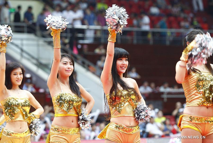 Cheerleaders dance prior to the 2013 Sino-Australian Men's International Basketball Challenge in Tianjin, north China, June 12, 2013. (Xinhua/Ding Xu)