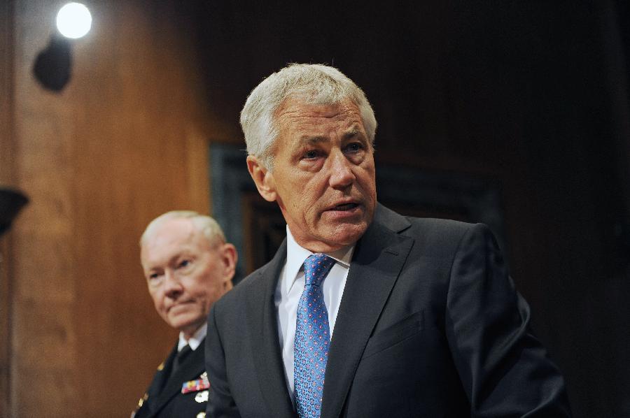 Chuck Hagel (R), U.S. Secretary of Defense and Martin Dempsey, Chairman of Joint Chiefs of Staff, testify before the U.S. Senate Budget Committee about U.S. President Barrack Obama's proposed budget request for fiscal year 2014 for defense, on Capitol Hill in Washington D.C., capital of the United States, June 12, 2013. (Xinhua/Zhang Jun) 