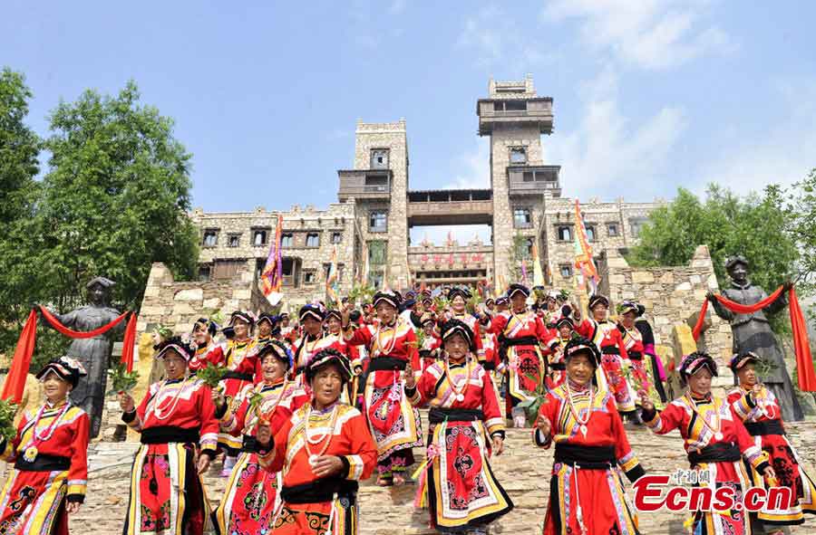 People of the Qiang ethnic group celebrate Wari'ezu Festival in Maoxian County, Southwest China's Sichuan Province, June 12, 2013. For thousands of years, there has been a convention among Qiang people, namely, to offer sacrifices to Sister Salang, the Goddess of Dance and Song. Every three years, Qiang people will get together and hold Wari'ezuconventional activities from May 3rd to May 5th in the lunar calendar. Since it is the only convention for Qiang females, it is also named by local people as Women's Day. (CNS/An Yuan)