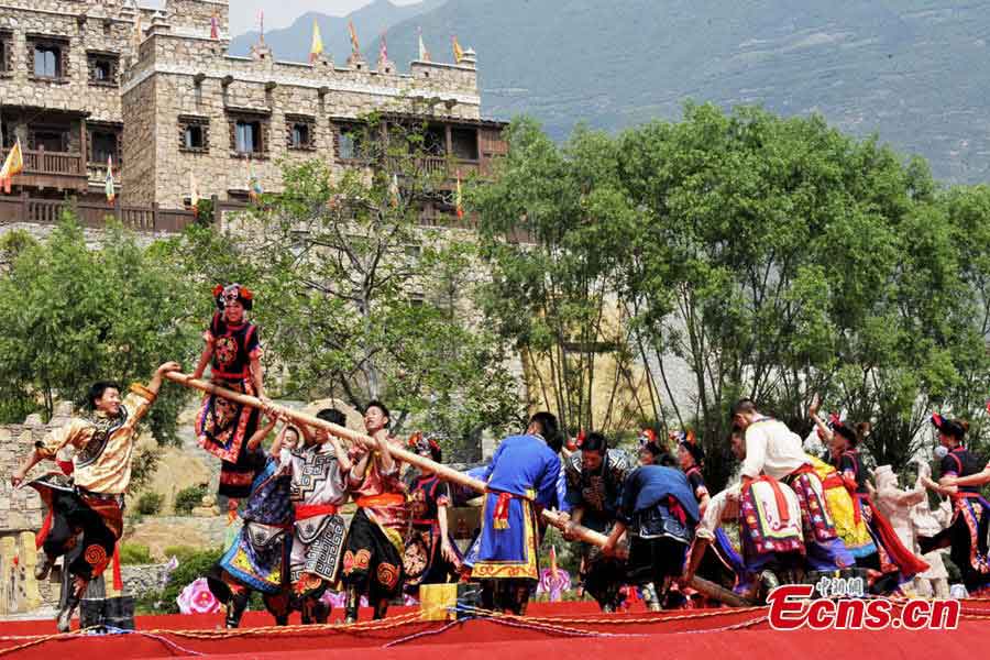 People of the Qiang ethnic group celebrate Wari'ezu Festival in Maoxian County, Southwest China's Sichuan Province, June 12, 2013. For thousands of years, there has been a convention among Qiang people, namely, to offer sacrifices to Sister Salang, the Goddess of Dance and Song. Every three years, Qiang people will get together and hold Wari'ezuconventional activities from May 3rd to May 5th in the lunar calendar. Since it is the only convention for Qiang females, it is also named by local people as Women's Day. (CNS/An Yuan)