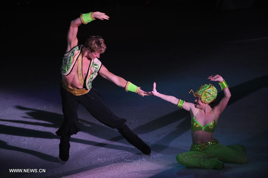 Dancers perform on cruise liner Mariner of the Seas at the Kai Tak Cruise Terminal in Hong Kong, south China, June 13, 2013. The new cruise terminal, built at the end of the runway of the former Kai Tak Airport, received its first liner, Mariner of the Seas on June 12, which has a capacity of 3,807 people. (Xinhua/Lui Siu Wai)