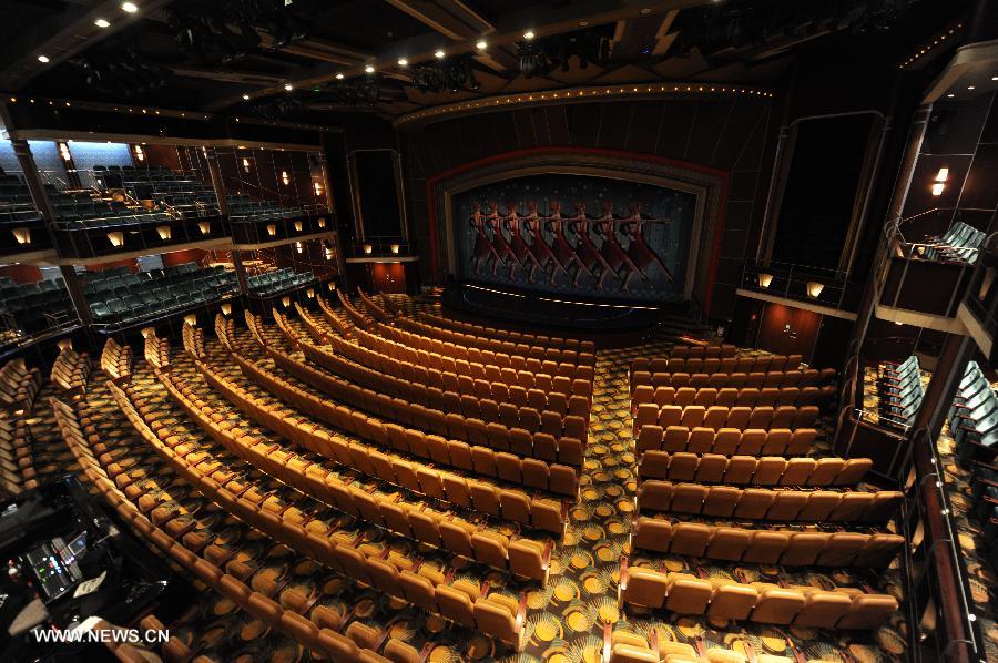 The opera house is pictured on the cruise liner Mariner of the Seas at the Kai Tak Cruise Terminal in Hong Kong, south China, June 13, 2013. The new cruise terminal, built at the end of the runway of the former Kai Tak Airport, received its first liner, Mariner of the Seas on June 12, which has a capacity of 3,807 people. (Xinhua/Lui Siu Wai)