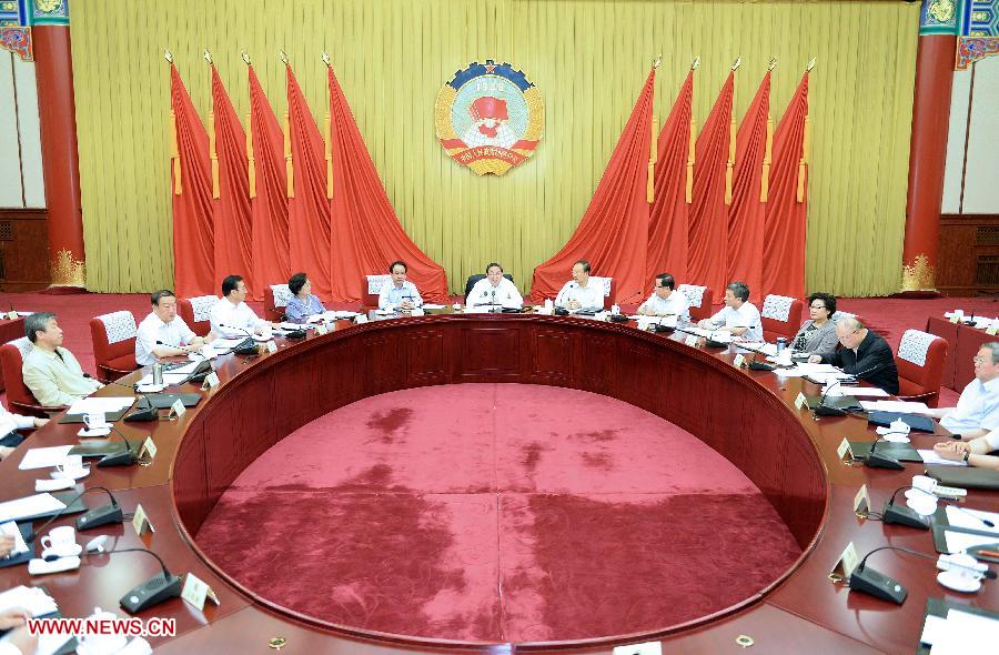 Yu Zhengsheng (C), chairman of the National Committee of the Chinese People's Political Consultative Conference (CPPCC), presides over and addresses the fourth meeting of the chairman and vice-chairpersons of the 12th CPPCC National Committee in Beijing, capital of China, June 13, 2013. (Xinhua/Li Tao)