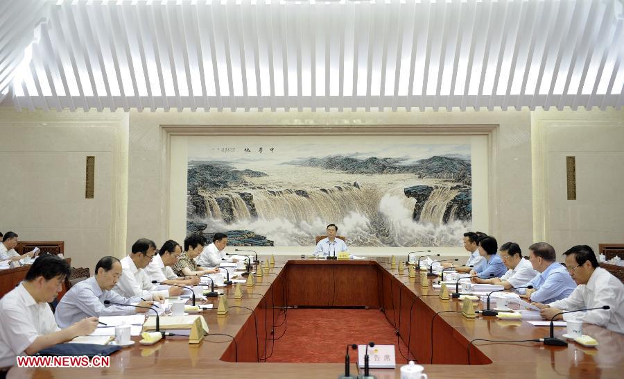 Zhang Dejiang (C), chairman of China's National People's Congress (NPC) Standing Committee, presides over the fifth meeting of the chairman and vice chairpersons of the 12th NPC Standing Committee at the Great Hall of the People in Beijing, capital of China, June 14, 2013. (Xinhua/Xie Huanchi)  