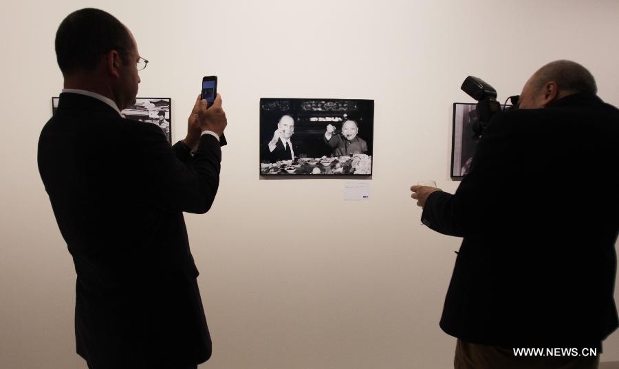People visit a photo exhibition on China-France relationship at Xinhua Gallery in Paris, France, June 13, 2013. The photo exhibition opened here on Thursday, to mark the 50th anniversary of the establishment of diplomatic relations between the two countries in 2014. (Xinhua/Gao Jing) 