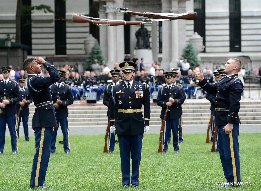 The U.S. Army Drill Team members perform at United States Army 238th Birthday Celebration during the Army Week which made up of veterans, reservists, military spouses and committed community members, in New York, the United States, June 14, 2013. (Xinhua/Wang Lei)