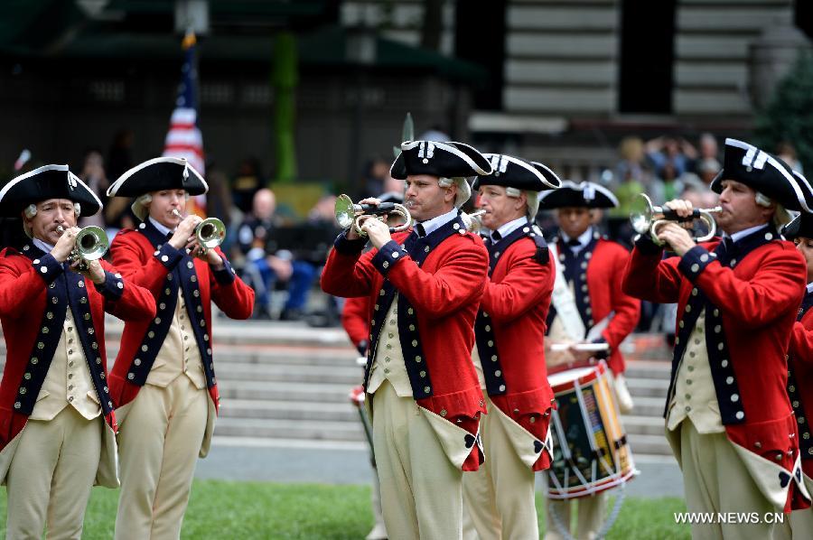 Drum Corps members attend United States Army 238th Birthday Celebration during the Army Week which made up of veterans, reservists, military spouses and committed community members, in New York, the United States, June 14, 2013. (Xinhua/Wang Lei)