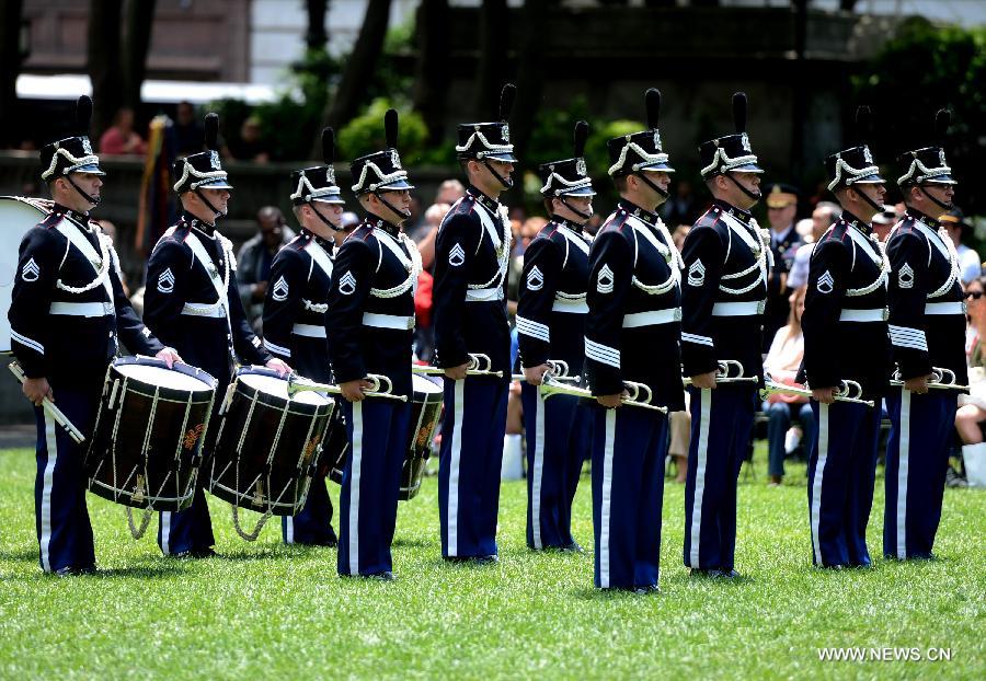 Drum Corps members attend United States Army 238th Birthday Celebration during the Army Week which made up of veterans, reservists, military spouses and committed community members, in New York, the United States, June 14, 2013. (Xinhua/Wang Lei)