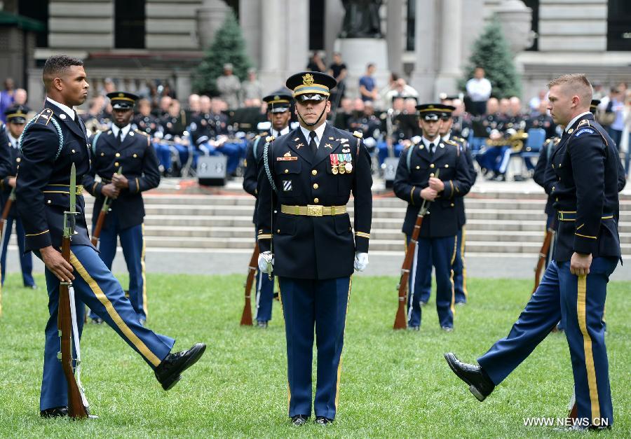 The U.S. Army Drill Team members perform at United States Army 238th Birthday Celebration during the Army Week which made up of veterans, reservists, military spouses and committed community members, in New York, the United States, June 14, 2013. (Xinhua/Wang Lei)