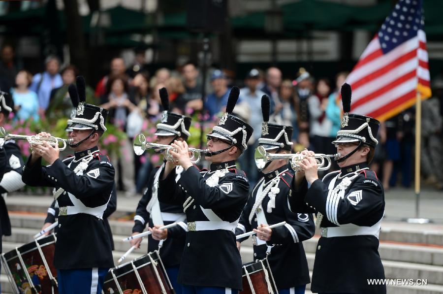 Drum Corps members attend United States Army 238th Birthday Celebration during the Army Week which made up of veterans, reservists, military spouses and committed community members, in New York, the United States, June 14, 2013. (Xinhua/Wang Lei)