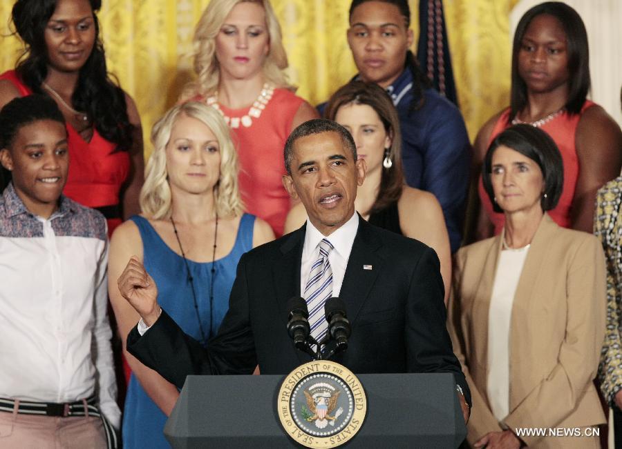 U.S. President Barack Obama (front) speaks during the welcome ceremony of WNBA champion Indiana Fever at the White House in Washington D.C. on June 14, 2013. (Xinhua/Fang Zhe)