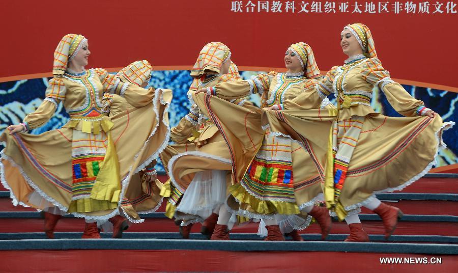 Actresses perform a dance in the Russian style at the opening ceremony of the 4th International Festival of Intangible Cultural Heritage in Chengdu, capital of southwest China's Sichuan Province, June 15, 2013. The nine-day festival kicked off here on Saturday. (Xinhua/Jin Liangkuai)