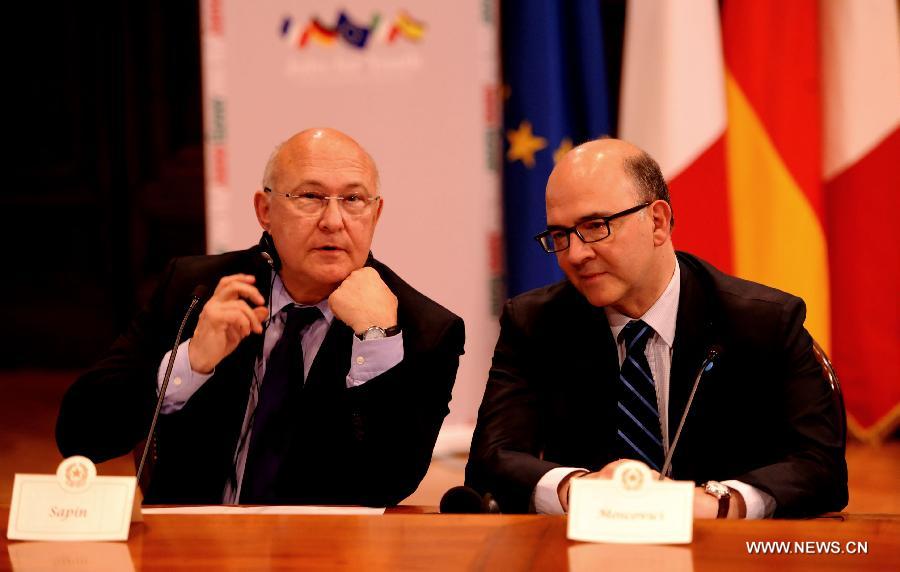 French Labour, Employment and Social Dialogue Minister Michel Sapin (L) and French Finance Minister Pierre Moscovici attend the press conference in Rome, Italy, June 14, 2013. A rapid improvement in the labor market to return Europe's stumbling economy to growth was at the center of a summit on jobs held in Rome on Friday by economic and labor ministers from Italy, France, Germany and Spain. (xinhua/Xu Nizhi) 