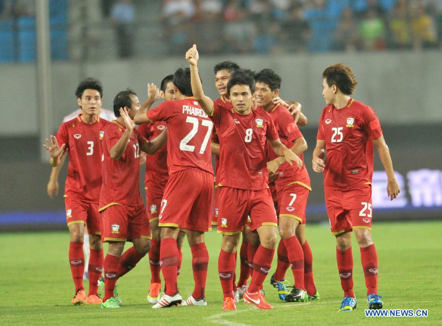 Thailand's players celebrate their scoring during the friendly soccer match against China in Hefei, east China's Anhui Province, June 15, 2013. Thailand won 5-1. (Xinhua/Guo Chen) 