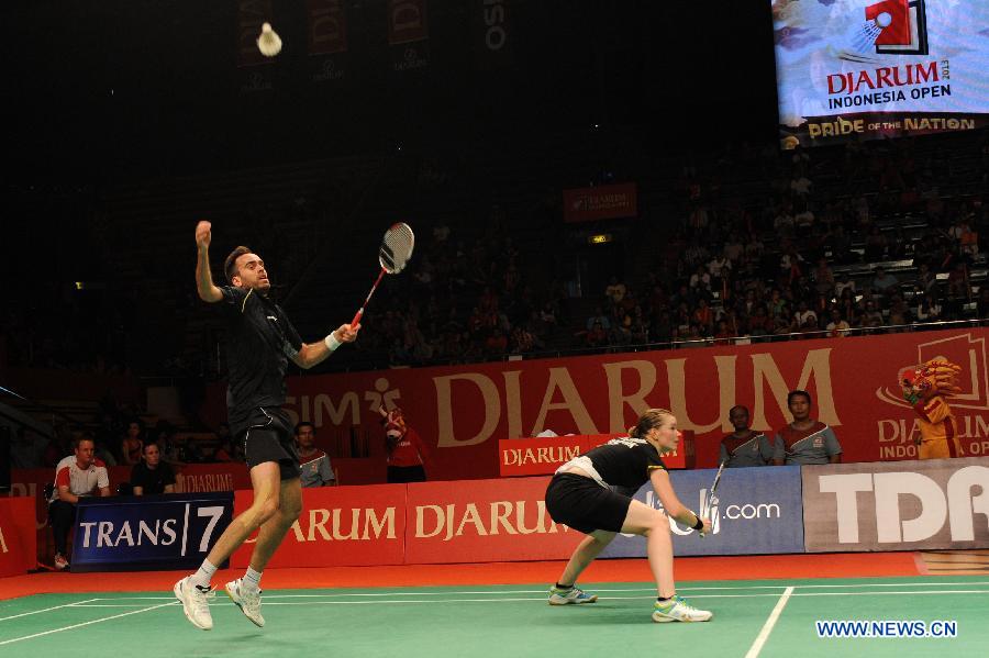 Joachim Fischer Nielsen (L) and Christinna Pedersen of Denmark compete during the mixed doubles finals match against Zhang Nan and Zhao Yunlei of China at the Djarum Indonesia Open 2013 in Jakarta, Indonesia, June 16, 2013. Zhang Nan and Zhao Yunlei won 2-1. (Xinhua/Veri Sanovri)