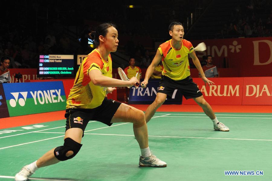 Zhang Nan (R) and Zhao Yunlei of China compete during the mixed doubles finals match against Joachim Fischer Nielsen and Christinna Pedersen of Denmark at the Djarum Indonesia Open 2013 in Jakarta, Indonesia, June 16, 2013. Zhang Nan and Zhao Yunlei won 2-1. (Xinhua/Veri Sanovri)