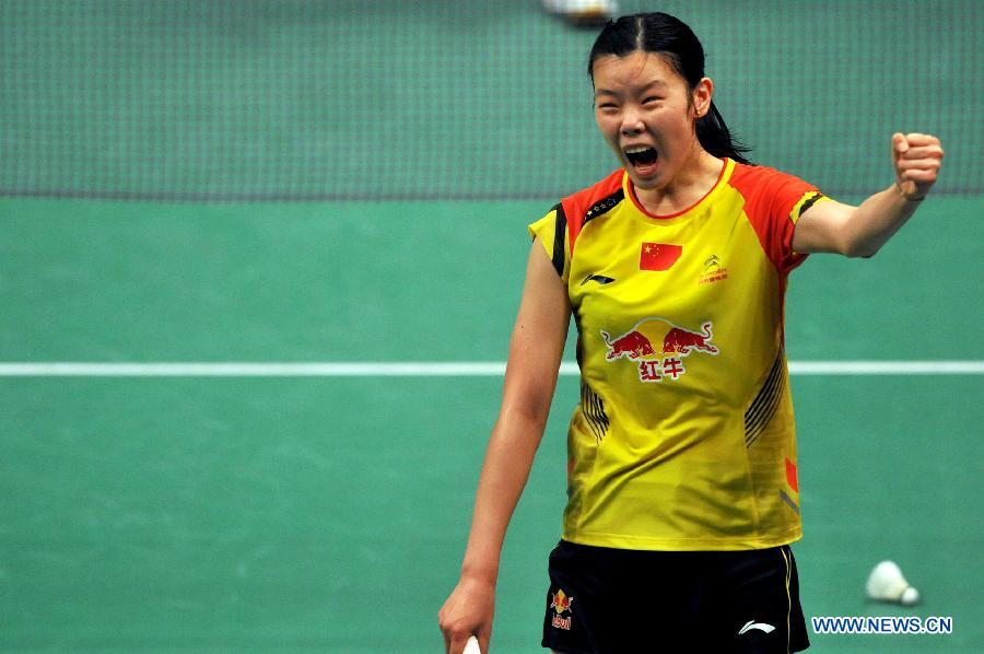 Li Xuerui of China celebrates after winning the women's singles final match against Juliane Schenk of Germany at the Djarum Indonesia Open 2013 in Jakarta, Indonesia, June 16, 2013. Li Xuerui won 2-1. (Xinhua/Agung Kuncahya B)