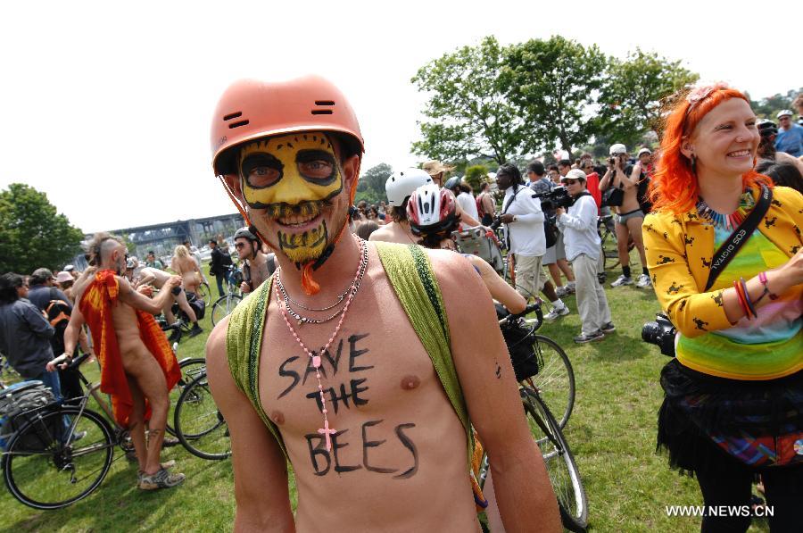 A participant shows message on his bare chest during the 2013 World Naked Bike Ride in Vancouver, Canada, on June 15, 2013. Over 80 cities in the world participated in this annual display of nakedness. (Xinhua/Sergei Bachlakov) 