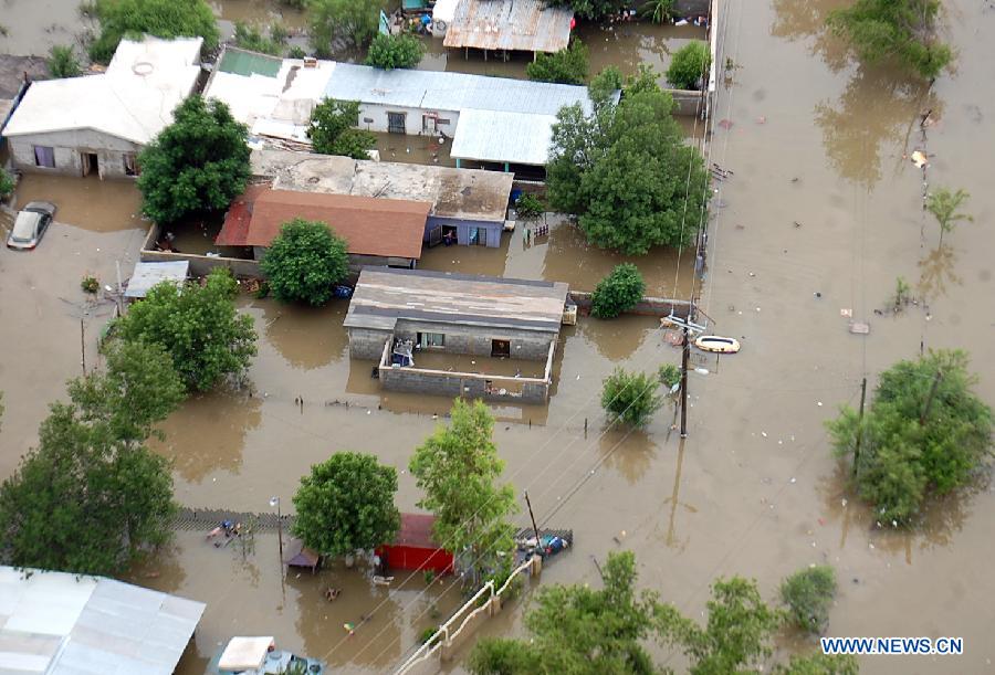 Image provided by Zocalo de Piedras Negras Newspaper shows flooded homes in Piedras Negras, Coahuila, Mexico, on June 16, 2013. After the heavy rains that afected Piedras Negras on Friday and Saturday, the Interior Ministry activated the DN-III Plan, and evacuated around one thousand people, according to the local media. (Xinhua/Tomas Escareno/Zocalo de Piedras Negras) 