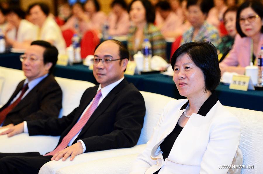Shen Yueyue (R, front), vice chairwoman of the Standing Committee of the National People's Congress and president of the All-China Women's Federation , attends the opening ceremony of a sub-forum themed on women of the fifth Straits Forum in Xiamen, southeast China's Fujian Province, June 16, 2013. (Xinhua/Zhang Guojun)