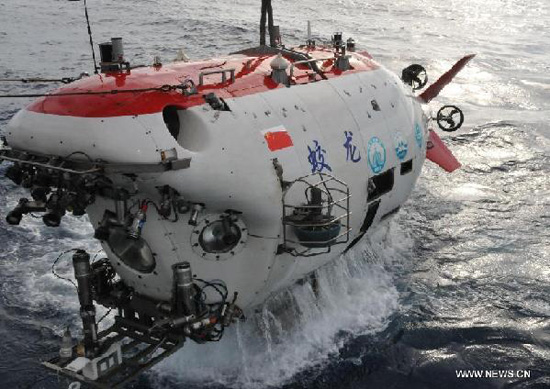 Photo taken on June 17, 2013 shows China's manned deep-sea submersible Jiaolong in the South China Sea, south China. Jiaolong finished the first diving operation for its first voyage of experimental application in the South China Sea at about 4:30 p.m. (0830 GMT) on June 17. Jiaolong set a new dive record after reaching a depth of 7,062 meters in the Pacific Ocean's Mariana Trench in June 2012. (Xinhua/Zhang Xudong)