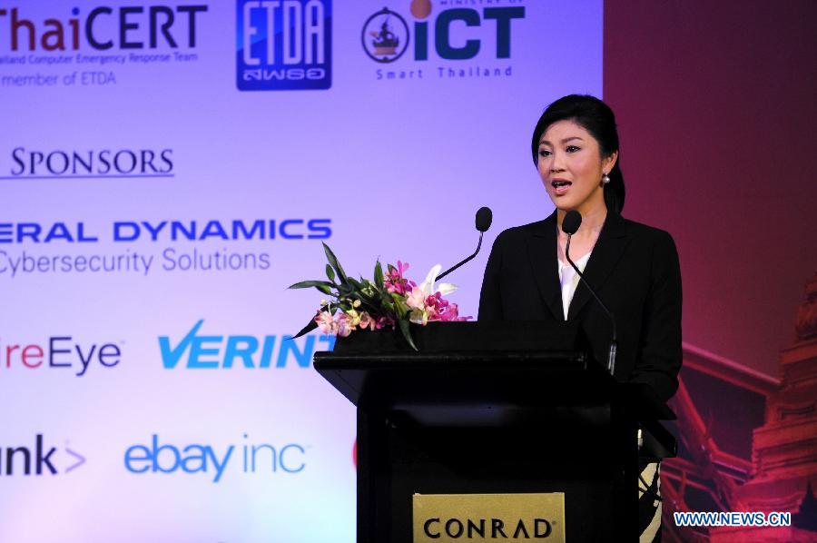 Thai Prime Minister Yingluck Shinawatra speaks during the opening ceremony of the 25th annual Forum of Incident Response and Security Teams (FIRST) conference in Bangkok, capital of Thailand, June 17, 2013. Under the theme of "Incident Response: Sharing to win", the five-day conference brings together leading experts from all over the world to share ideas on international security. (Xinhua/Gao Jianjun) 