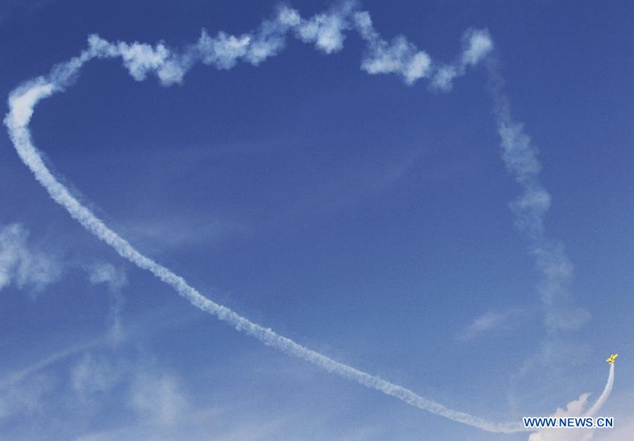 A Breitling aircraft performs during the 50th International Paris Air Show at the Le Bourget airport in Paris, France, June 17, 2013. The Paris Air Show runs from June 17 to 23. (Xinhua/Gao Jing) 