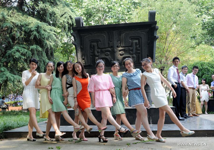 Graduates of the School of Medicine of the Southeast University (SEU) pose for a group photo during their graduation ceremony in Nanjing, capital of east China's Jiangsu Province, June 17, 2013. (Xinhua/Sun Can)