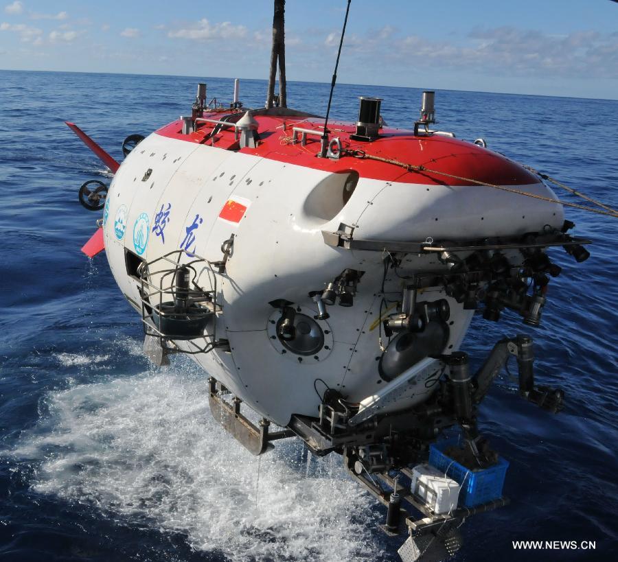 China's manned deep-sea submersible Jiaolong is seen after finishing a deep-sea dive into the south China sea, June 18, 2013. The Jiaolong manned deep-sea submersible on Tuesday carried its first scientist Zhou Huaiyang, professor of the School of Marine and Earth Science at Tongji University, as crew member during a deep-sea dive. (Xinhua/Zhang Xudong)