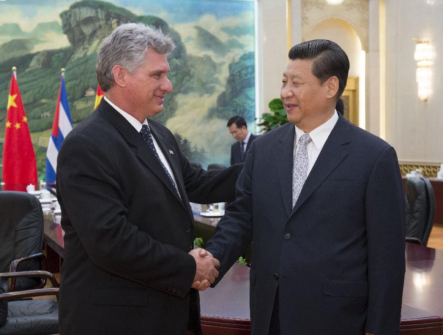 Chinese President Xi Jinping (R) meets with Miguel Diaz-Canel, Cuba's first Vice President of the Councils of State and Ministers, in Beijing, capital of China, June 18, 2013. (Xinhua/Li Xueren)