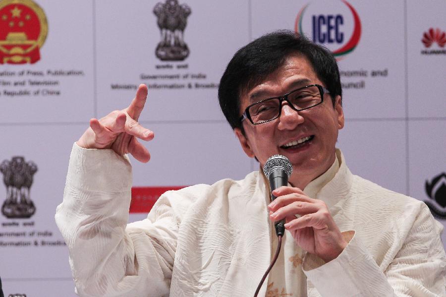 Actor Jackie Chan reacts to the media at the news conference of the Chinese film festival in New Delhi, India, on June. 18, 2013. The 5-day festival opened on Tuesday to boost bilateral movie and culture cooperation between China and India. (Xinhua/Zheng Huansong)