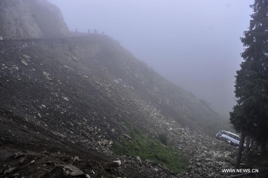Photo taken on June 18, 2013 shows the valley where the accident happened in Changji City, northwest China's Xinjiang Uygur Autonomous Region. The death toll has risen to 15 in an accident in which a tourist bus fell into a valley on Tuesday in Changji, according to the local government. Four people died at the scene, while another 11 people died after hospital treatments failed. The other 21 passengers sustained injuries and are still being treated. Heavy fog that reduced visibility has been blamed for the accident. (Xinhua)