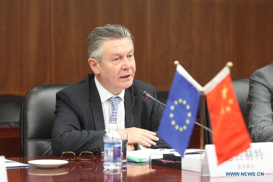 European Union(EU) Trade Commissioner Karel De Gucht addresses the 27th China-EU Economic and Trade Joint Committee meeting in Beijing, capital of China, June 21, 2013. The meeting was held here on Friday. (Xinhua/Xing Guangli)
