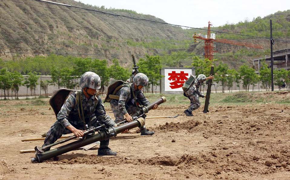 Officers and men in live-ammunition drill