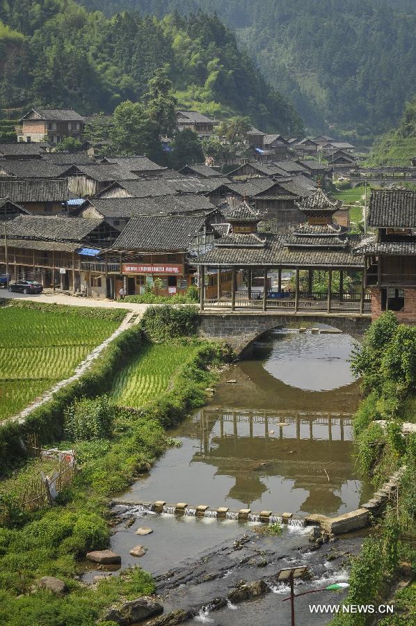 Photo taken on June 21, 2013 shows the Dimen Dong minority village in the morning in Liping County of southwest China's Guizhou Province. Dimen is a Dong minority village with about 2,500 villagers. It is protected properly and all the villagers could enjoy their peaceful and quiet rural life as they did in the past over 700 years. (Xinhua/Ou Dongqu) 
