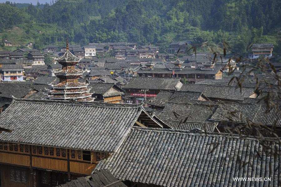 Photo taken on June 21, 2013 shows the Dimen Dong minority village in the morning in Liping County of southwest China's Guizhou Province. Dimen is a Dong minority village with about 2,500 villagers. It is protected properly and all the villagers could enjoy their peaceful and quiet rural life as they did in the past over 700 years. (Xinhua/Ou Dongqu)