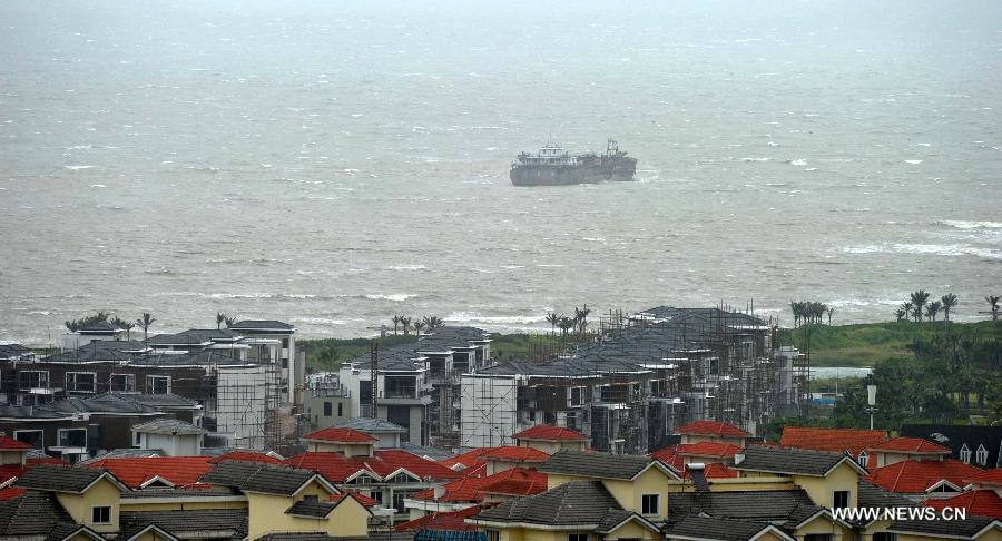 A boat anchors in a harbor in Haikou, capital of south China's Hainan Province, Jun 22, 2013. Tropical storm "Bebinca" is estimated to arrive in south China's Guangdong Province on Saturday afternoon, the first to make landfall in China this year, the National Meteorological Center (NMC) said on Saturday. Affected by the tropical storm, coastal areas in Hainan and Guangdong provinces were battered by gales and torrential rain, the center reported. (Xinhua/Zhao Yingquan) 